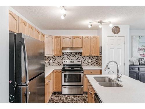 42 Evansford Grove Nw, Calgary, AB - Indoor Photo Showing Kitchen With Double Sink With Upgraded Kitchen