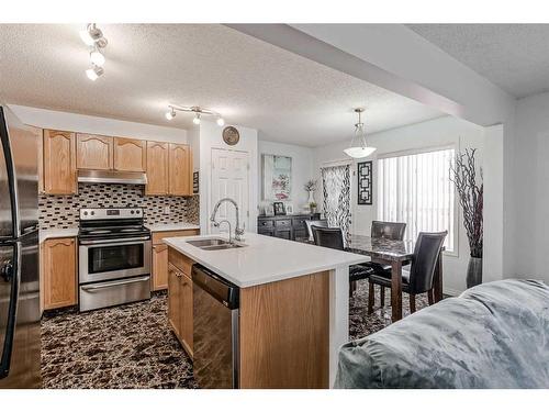 42 Evansford Grove Nw, Calgary, AB - Indoor Photo Showing Kitchen With Double Sink
