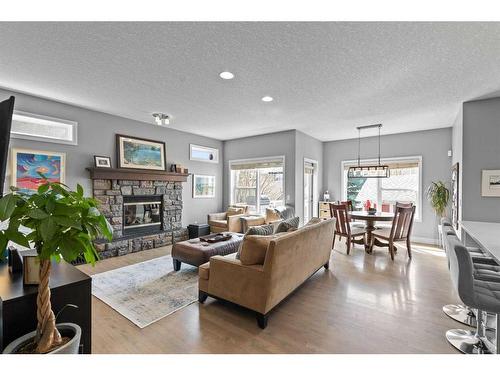 2205 Vimy Way Sw, Calgary, AB - Indoor Photo Showing Living Room With Fireplace
