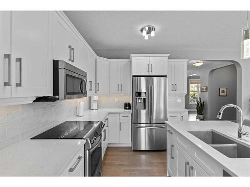 2205 Vimy Way Sw, Calgary, AB - Indoor Photo Showing Kitchen With Double Sink With Upgraded Kitchen