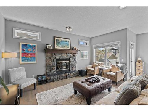 2205 Vimy Way Sw, Calgary, AB - Indoor Photo Showing Living Room With Fireplace