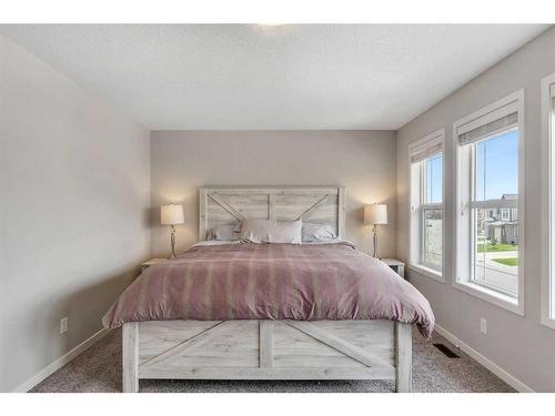 331 Reunion Green Nw, Airdrie, AB - Indoor Photo Showing Bedroom