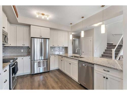 331 Reunion Green Nw, Airdrie, AB - Indoor Photo Showing Kitchen With Double Sink With Upgraded Kitchen