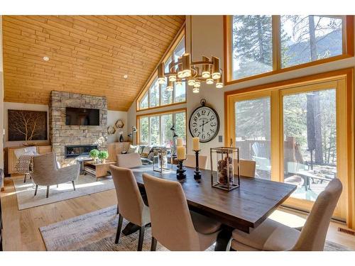 421 Stewart Creek Close, Canmore, AB - Indoor Photo Showing Dining Room With Fireplace