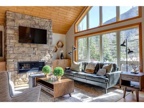421 Stewart Creek Close, Canmore, AB - Indoor Photo Showing Living Room With Fireplace