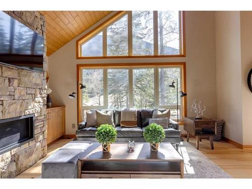 421 Stewart Creek Close, Canmore, AB - Indoor Photo Showing Living Room With Fireplace