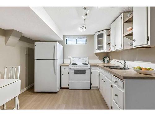 115 Deer Lane Close Se, Calgary, AB - Indoor Photo Showing Kitchen With Double Sink