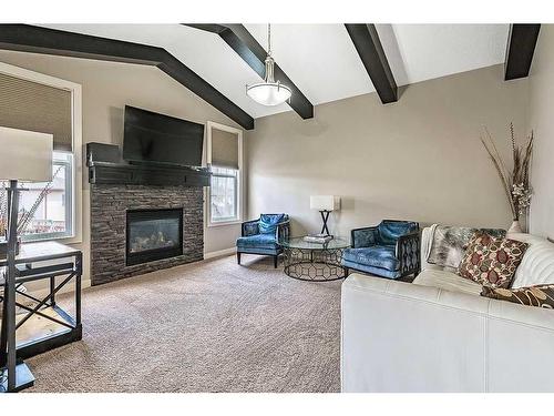 2098 High Country Rise Nw, High River, AB - Indoor Photo Showing Living Room With Fireplace