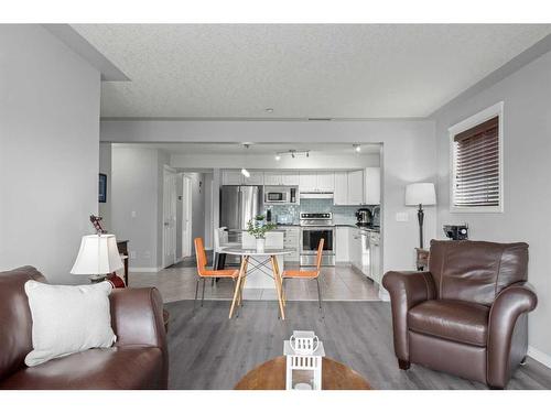202-1608 12 Avenue Sw, Calgary, AB - Indoor Photo Showing Living Room