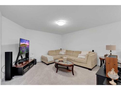 240 Carringsby Landing Nw, Calgary, AB - Indoor Photo Showing Living Room