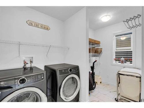 240 Carringsby Landing Nw, Calgary, AB - Indoor Photo Showing Laundry Room