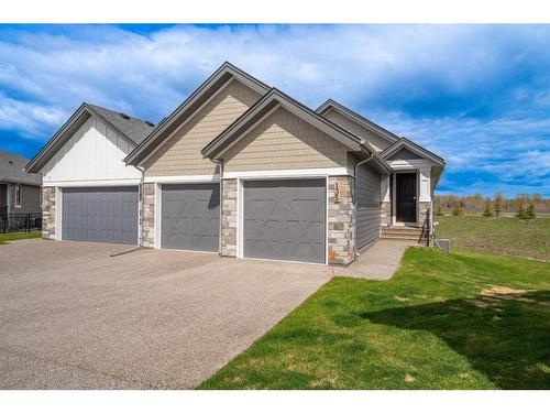 135 Clear Creek Place, Rural Rocky View County, AB - Outdoor With Facade