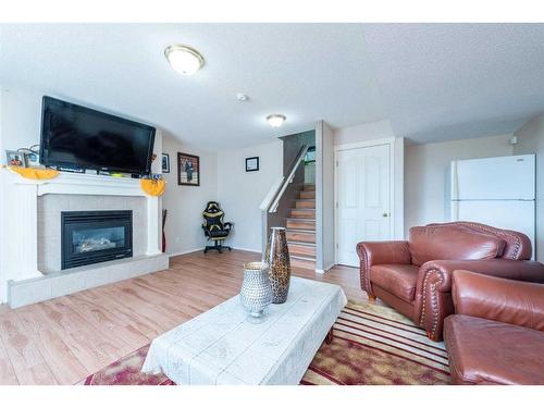 137 Tarington Court Ne, Calgary, AB - Indoor Photo Showing Living Room With Fireplace