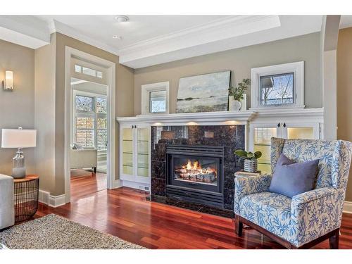 210 8 Avenue Nw, Calgary, AB - Indoor Photo Showing Living Room With Fireplace