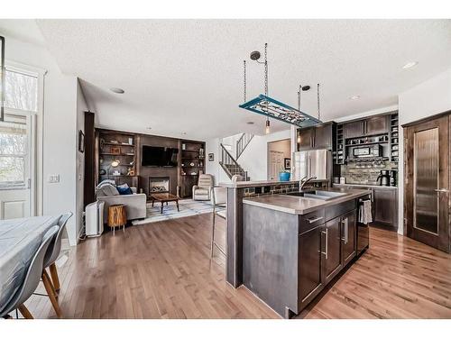 22 Heritage Landing, Cochrane, AB - Indoor Photo Showing Kitchen With Double Sink