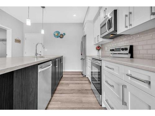 303-4150 Seton Drive Se, Calgary, AB - Indoor Photo Showing Kitchen With Upgraded Kitchen