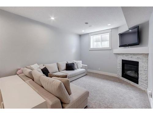 4331 19 Avenue Nw, Calgary, AB - Indoor Photo Showing Living Room With Fireplace