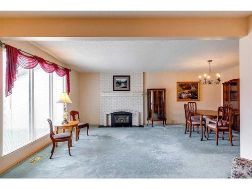 855 Cannell Road, Calgary, AB - Indoor Photo Showing Living Room With Fireplace
