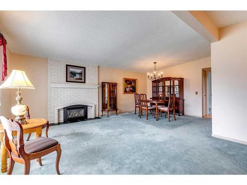 855 Cannell Road, Calgary, AB - Indoor Photo Showing Living Room With Fireplace