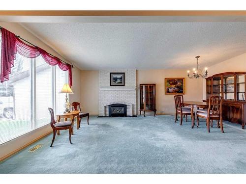 855 Cannell Road, Calgary, AB - Indoor Photo Showing Other Room With Fireplace