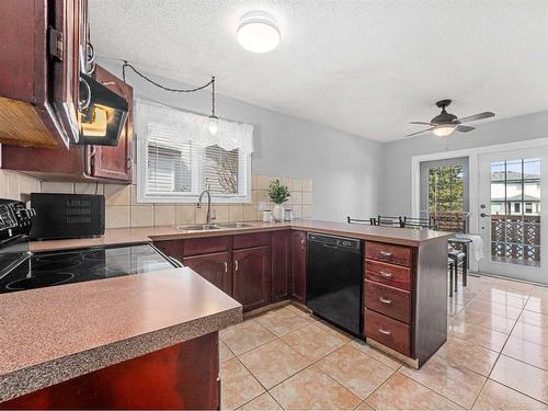 100 Shawbrooke Circle Sw, Calgary, AB - Indoor Photo Showing Kitchen With Double Sink