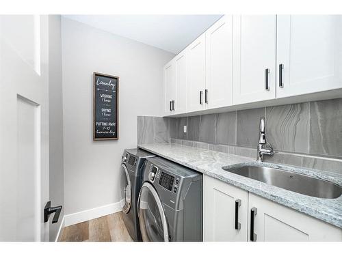 176 Kinniburgh Way, Chestermere, AB - Indoor Photo Showing Laundry Room