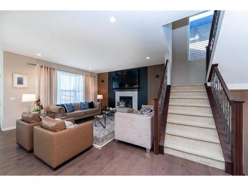 8 Auburn Springs Boulevard Se, Calgary, AB - Indoor Photo Showing Living Room With Fireplace