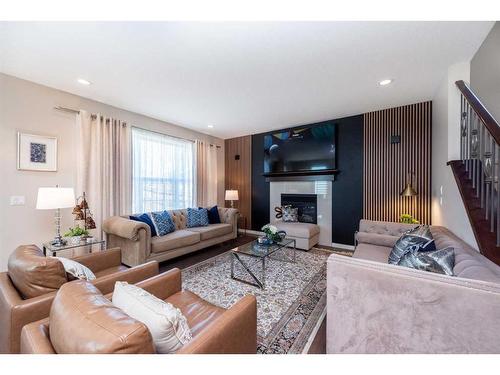 8 Auburn Springs Boulevard Se, Calgary, AB - Indoor Photo Showing Living Room With Fireplace