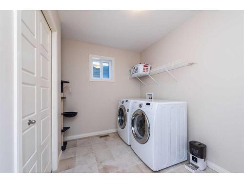 8 Auburn Springs Boulevard Se, Calgary, AB - Indoor Photo Showing Laundry Room