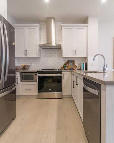 258 South Shore Court, Chestermere, AB - Indoor Photo Showing Kitchen With Stainless Steel Kitchen With Upgraded Kitchen