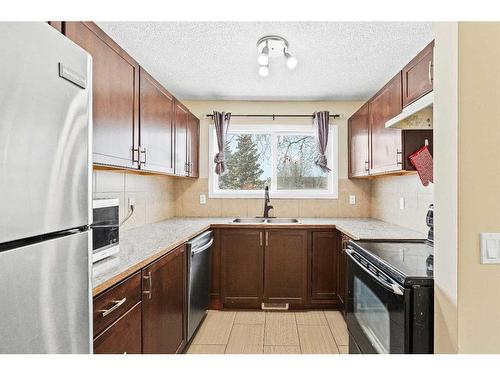801-700 Allen Street Se, Airdrie, AB - Indoor Photo Showing Kitchen With Stainless Steel Kitchen With Double Sink