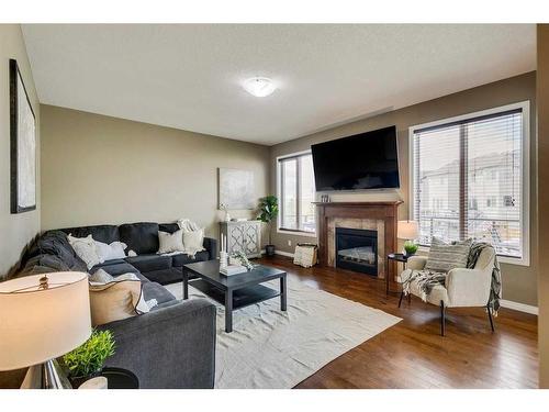 56 Windgate Close Sw, Airdrie, AB - Indoor Photo Showing Living Room With Fireplace