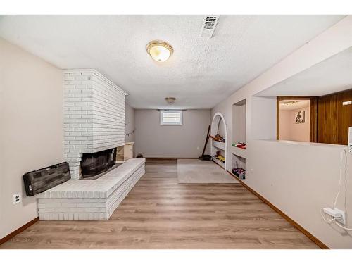 423 33 Avenue Nw, Calgary, AB - Indoor Photo Showing Other Room With Fireplace