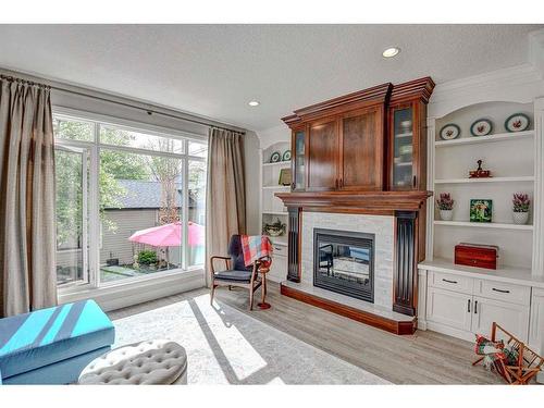 4208 16A Street Sw, Calgary, AB - Indoor Photo Showing Living Room With Fireplace