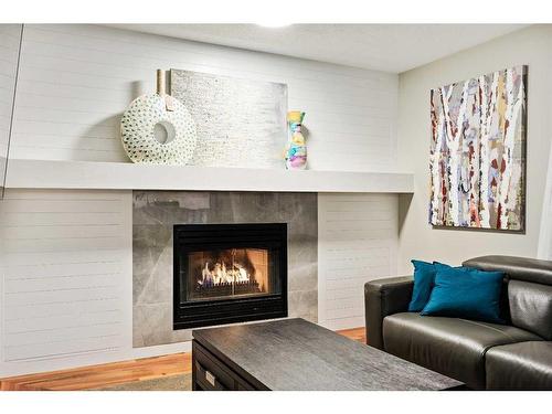 612 Meadowbrook Bay Se, Airdrie, AB - Indoor Photo Showing Living Room With Fireplace