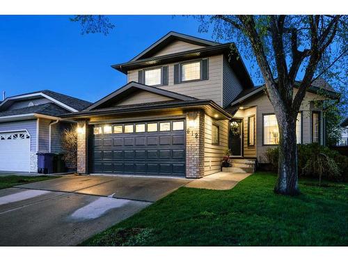 612 Meadowbrook Bay Se, Airdrie, AB - Outdoor With Facade