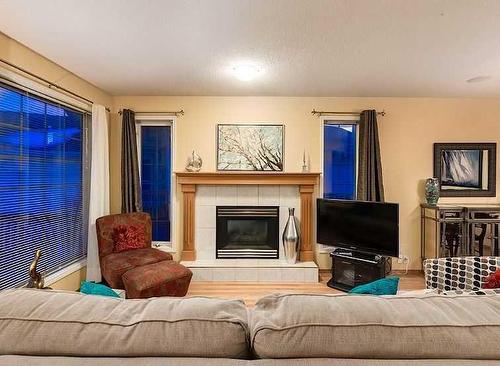 154 Douglas Glen Close Se, Calgary, AB - Indoor Photo Showing Living Room With Fireplace