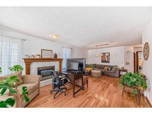 154 Douglas Glen Close Se, Calgary, AB - Indoor Photo Showing Living Room With Fireplace