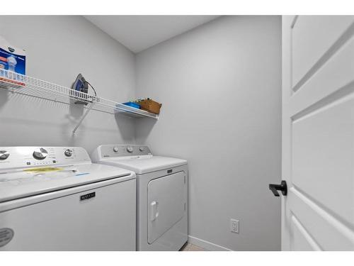 147 Dawson Harbour Hill, Chestermere, AB - Indoor Photo Showing Laundry Room