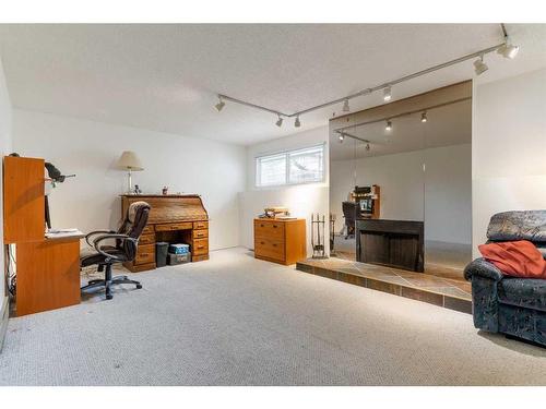 976 Bracewood Rise Sw, Calgary, AB - Indoor With Fireplace