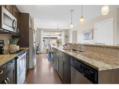 20 Evansborough Common Nw, Calgary, AB - Indoor Photo Showing Kitchen With Double Sink With Upgraded Kitchen