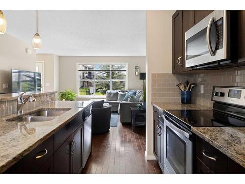 20 Evansborough Common Nw, Calgary, AB - Indoor Photo Showing Kitchen With Double Sink
