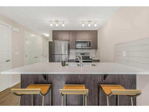 1334-7451 Falconridge Boulevard Ne, Calgary, AB - Indoor Photo Showing Kitchen With Double Sink With Upgraded Kitchen
