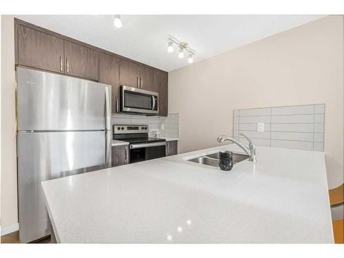 1334-7451 Falconridge Boulevard Ne, Calgary, AB - Indoor Photo Showing Kitchen With Double Sink With Upgraded Kitchen