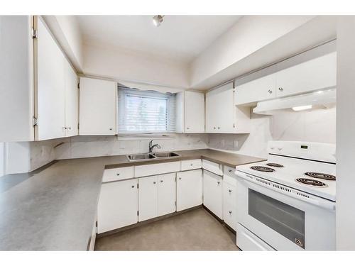 4617 Stanley Road Sw, Calgary, AB - Indoor Photo Showing Kitchen With Double Sink