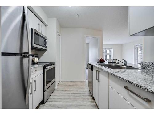 2215-4641 128 Avenue Ne, Calgary, AB - Indoor Photo Showing Kitchen With Stainless Steel Kitchen With Double Sink