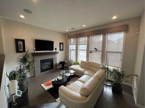 987 Evanston Drive Nw, Calgary, AB - Indoor Photo Showing Living Room With Fireplace