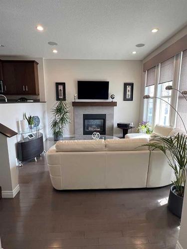987 Evanston Drive Nw, Calgary, AB - Indoor Photo Showing Living Room With Fireplace