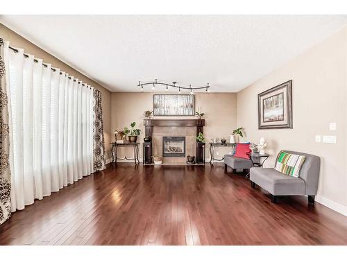 1589 Copperfield Boulevard Se, Calgary, AB - Indoor Photo Showing Living Room With Fireplace