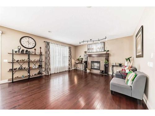 1589 Copperfield Boulevard Se, Calgary, AB - Indoor Photo Showing Living Room With Fireplace